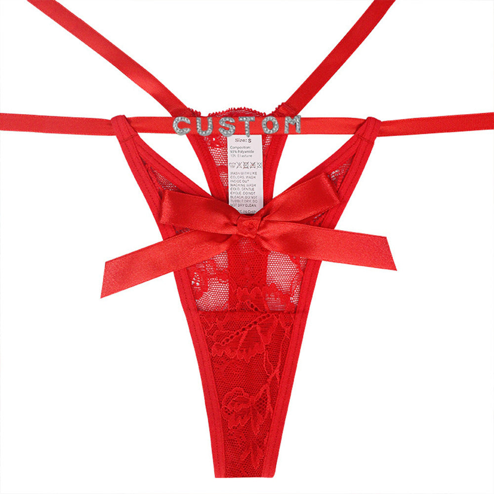 Red lace lingerie with a bow on a white background